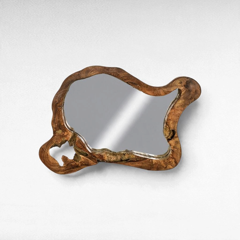 Chora Barefoot Luxury Living teak wood mirror with an organic, irregular live-edge frame on a white wall.
