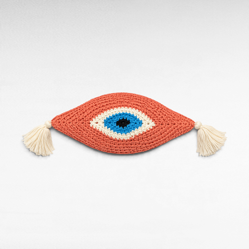 Chora Barefoot Luxury Living handmade knitted eye pillow in coral, blue, and white with decorative side tassels