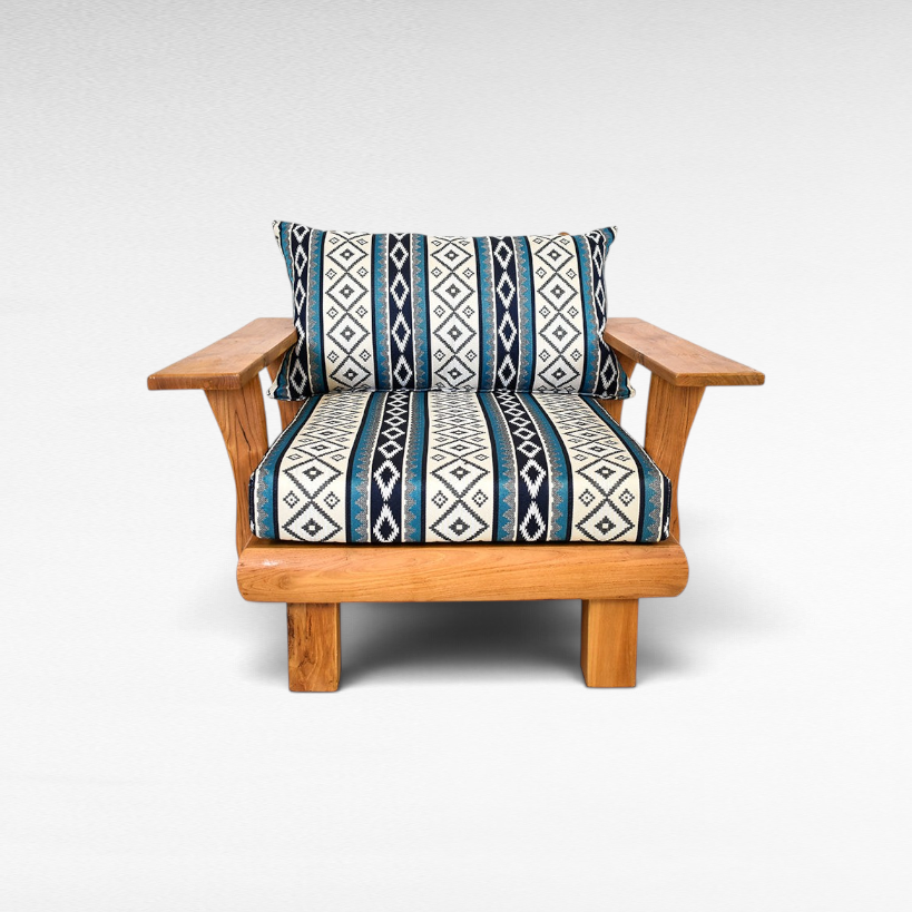 Chora Barefoot Luxury Living teak wood armchair with blue and white geometric patterned cushions