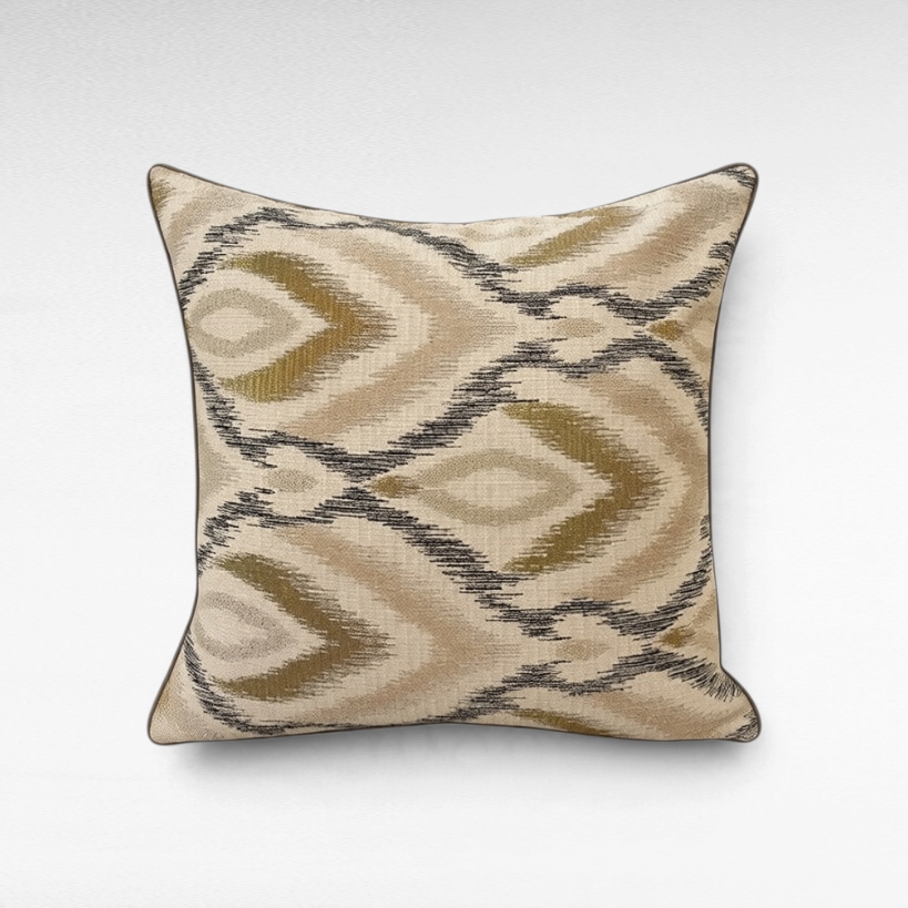Chora Barefoot Luxury Living square ikat throw pillow in beige, olive green, and charcoal with piped edges.