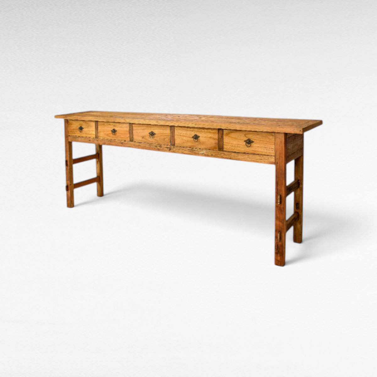 Chora Barefoot Luxury Living rustic teak wood console table featuring five drawers with antique metal ring pulls.