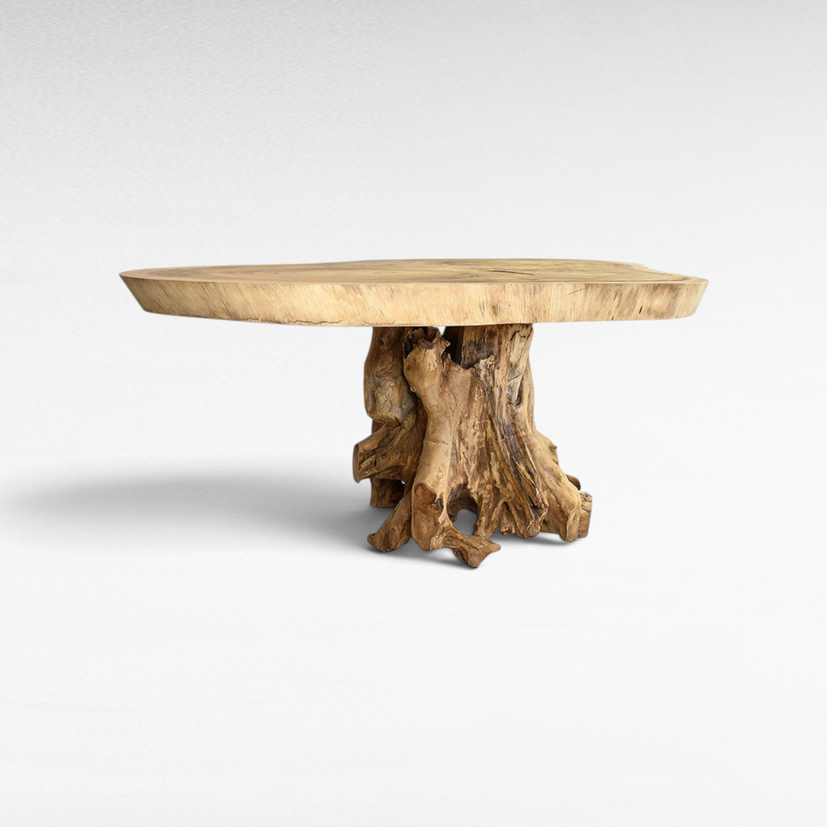 Chora Barefoot Luxury Living live edge Suar wood dining table with a sculptural root base and natural wood grain.