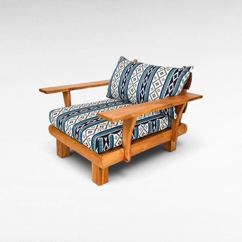 Chora Barefoot Luxury Living teak wood sofa chair with blue and white geometric patterned cushions