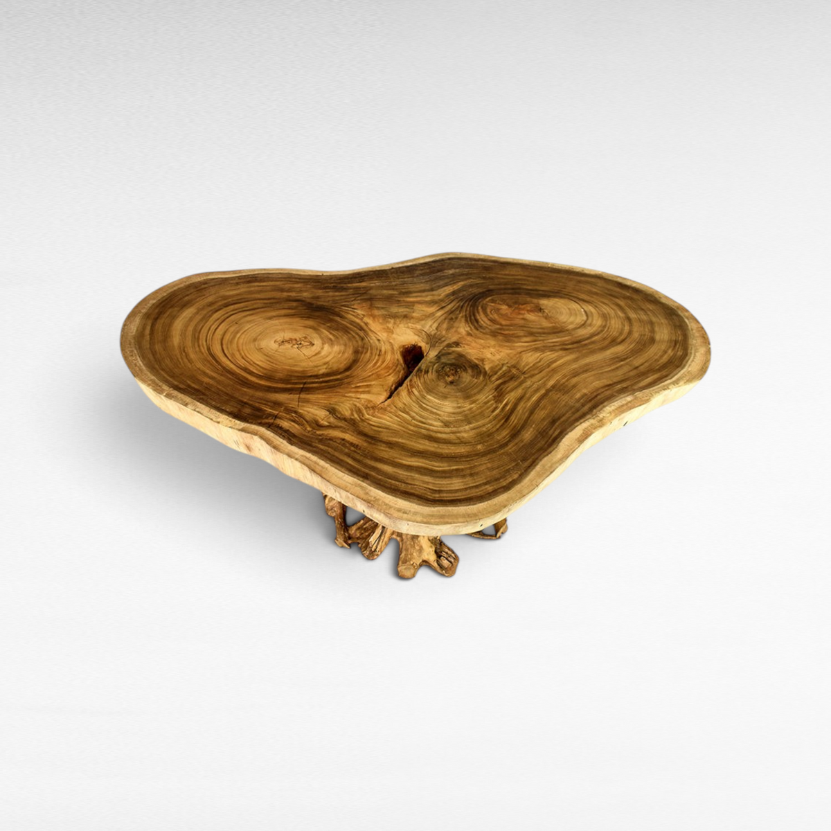 Chora Barefoot Luxury Living Suar wood dining table with a natural live edge slab and sculptural root base.