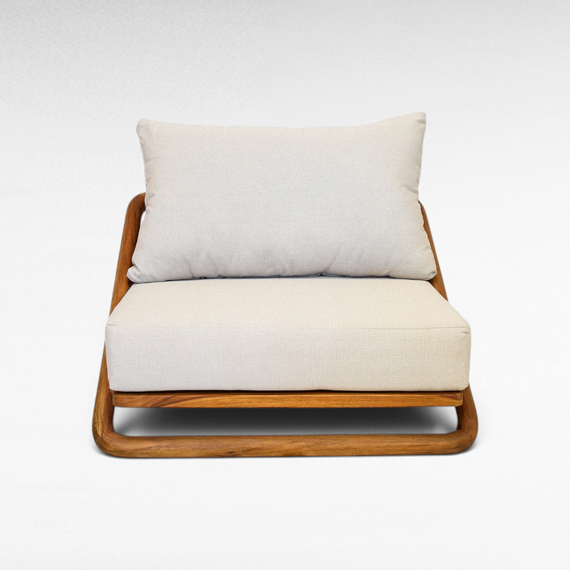 Chora Barefoot Luxury Living teak wood lounge chair with a beige upholstered seat and back cushion