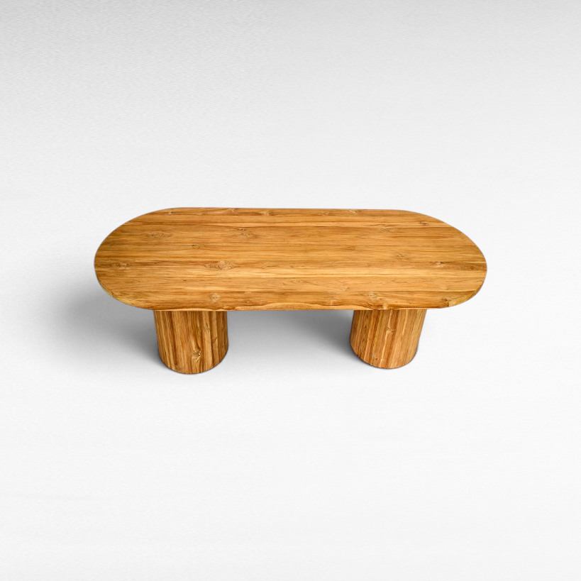 Chora Barefoot Luxury Living oval suar wood dining table with sculptural grain and sturdy cylindrical base