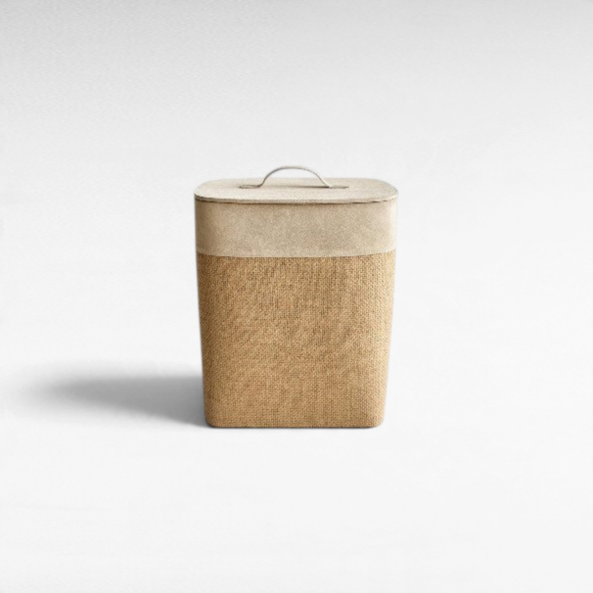 Chora Barefoot Luxury Living beige storage basket with a suede leather lid and textured jute body on a white background