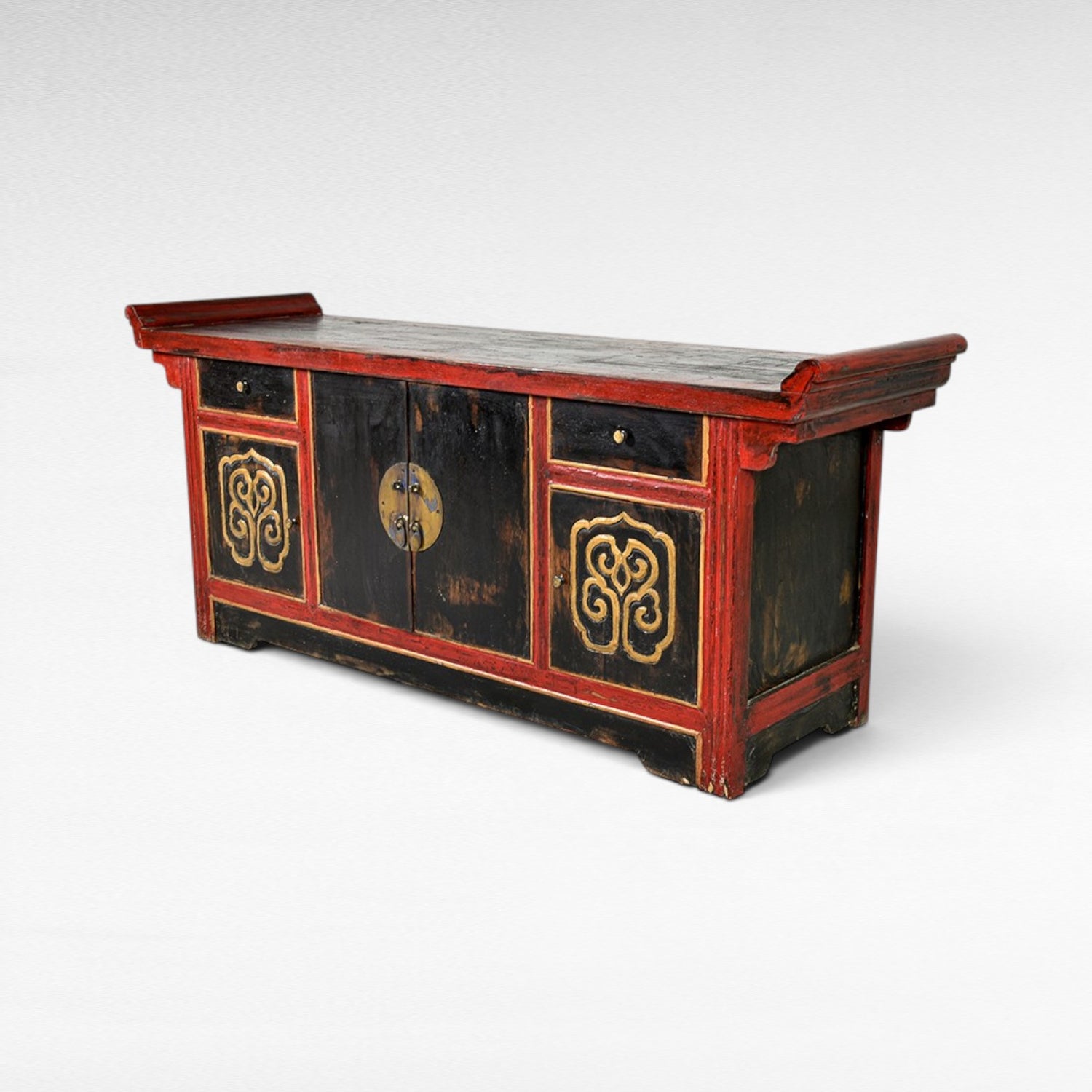 Chora Barefoot Luxury Living antique black buffet with red trim and gold ornate carvings, two drawers and two doors.