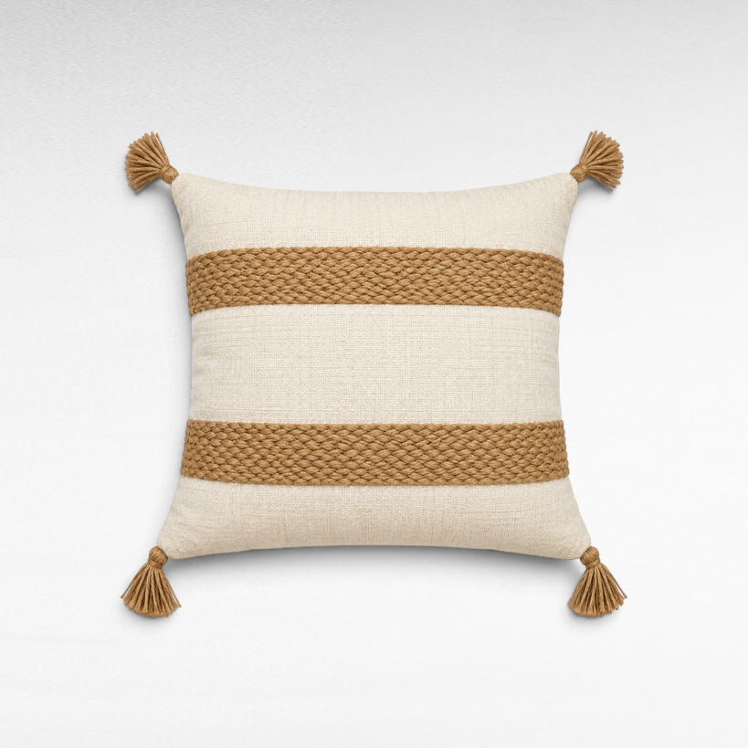 Chora Barefoot Luxury Living square beige pillow with brown braided cord stripes and decorative corner tassels