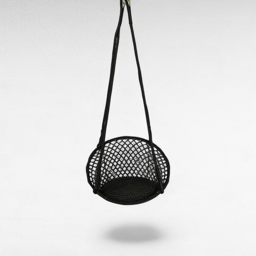 Chora Barefoot Luxury Living black macrame rope hammock swing with padded seat, perfect for serene relaxation.
