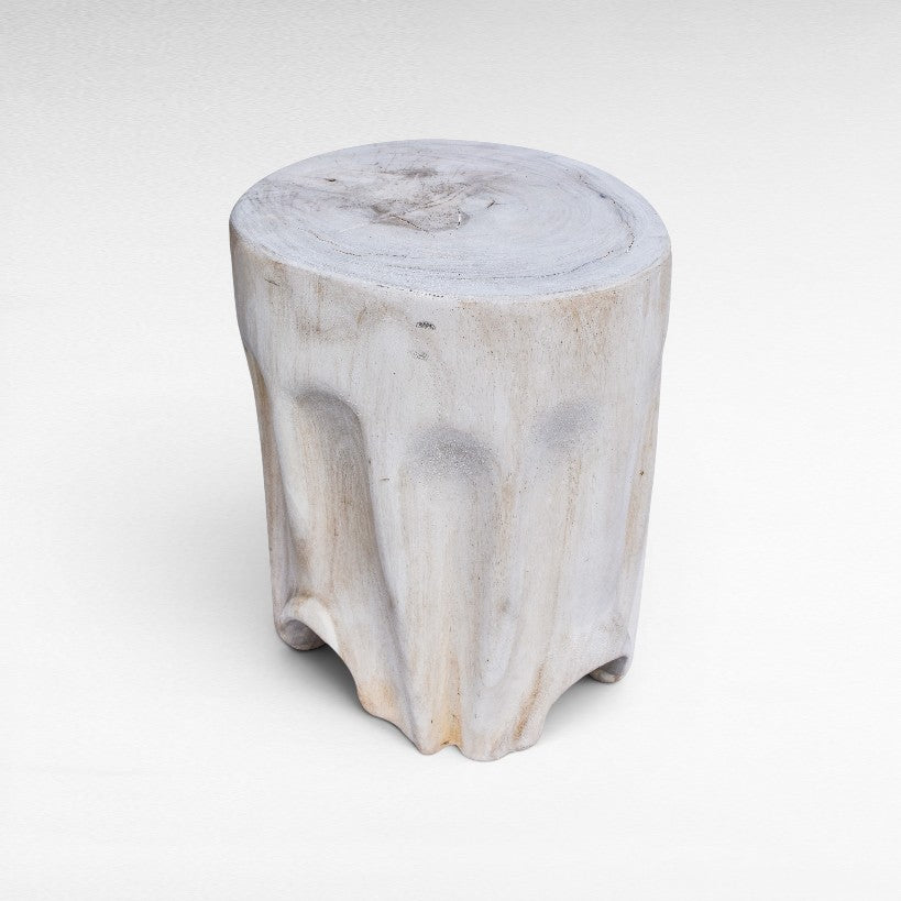 Chora Barefoot Luxury Living bleached suar wood stool with a natural tree trunk design and organic sculpted base.