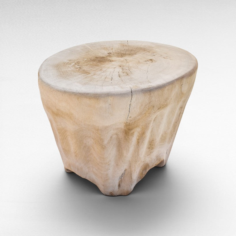 Chora Barefoot Luxury Living bleached suar wood stool with a natural tree trunk design and visible wood grain texture.