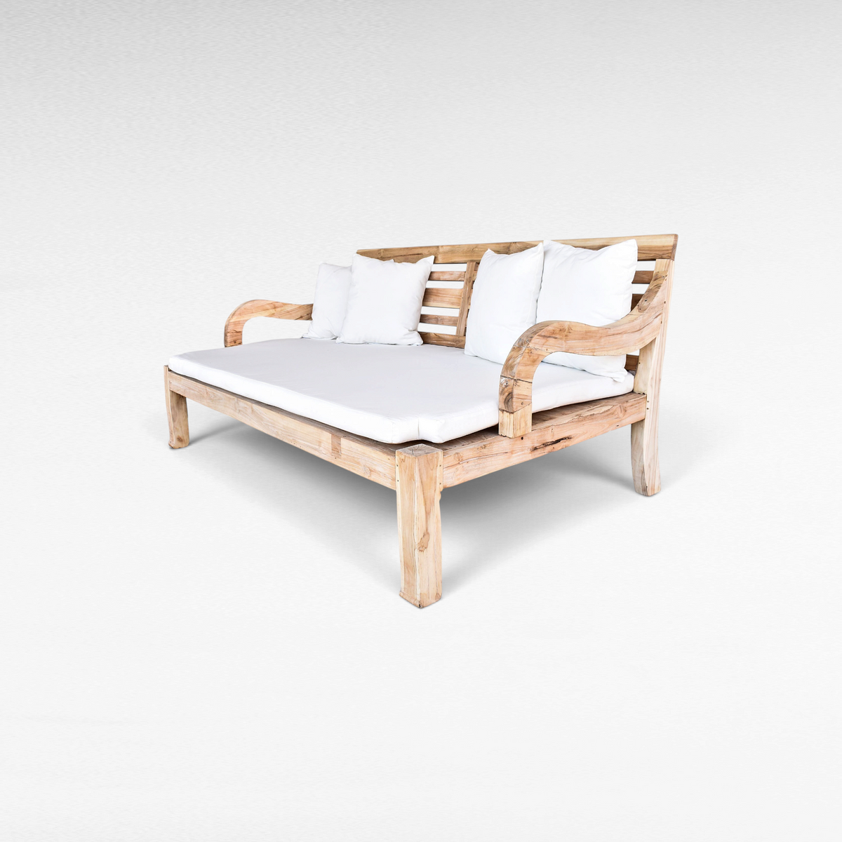 Chora Barefoot Luxury Living bleached teak wood double daybed with white mattress and plush cushions on white background