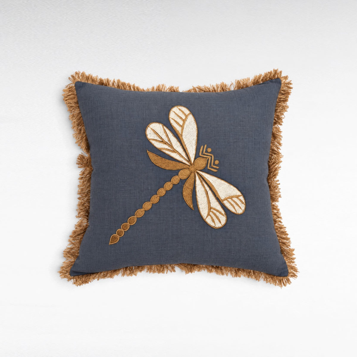 Chora Barefoot Luxury Living square blue linen pillow featuring an embroidered gold dragonfly and fringed edges