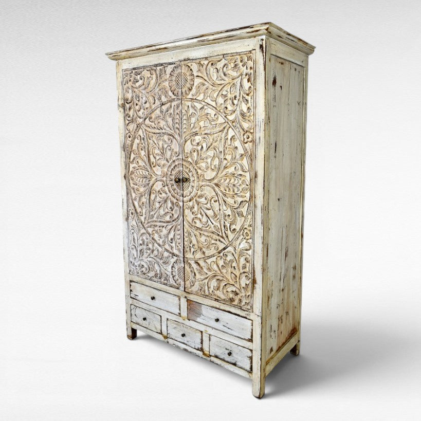 Chora Barefoot Luxury Living distressed white carved wood cupboard with 6 drawers and ornate floral door panels.