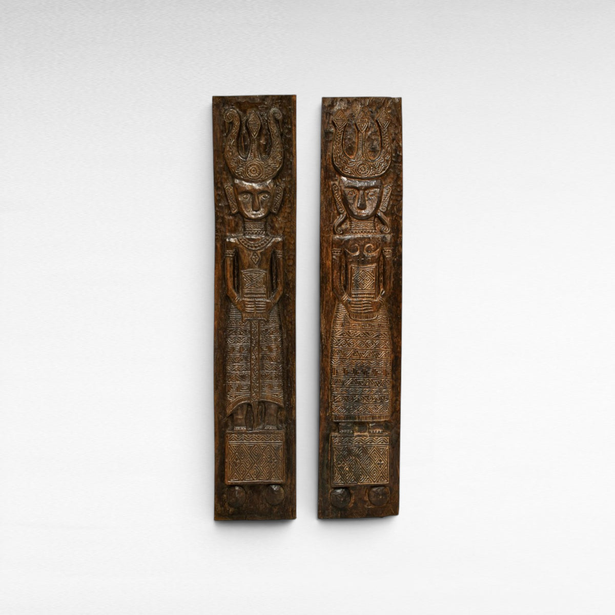 Chora Barefoot Luxury Living set of two carved wooden statues, man and woman, 210cm tall, intricate patterns.