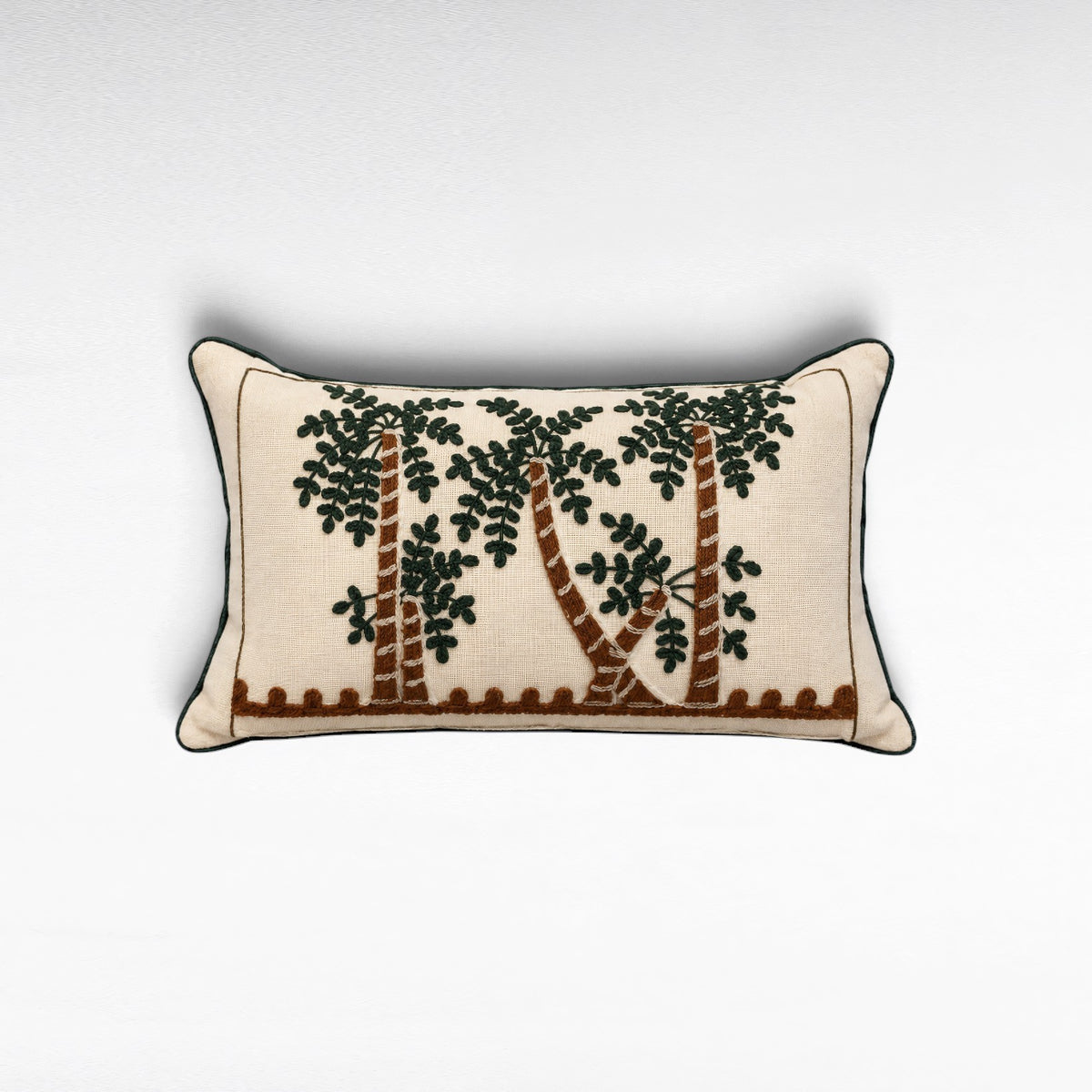 Chora Barefoot Luxury Living rectangular throw pillow with embroidered palm tree design on cream linen fabric