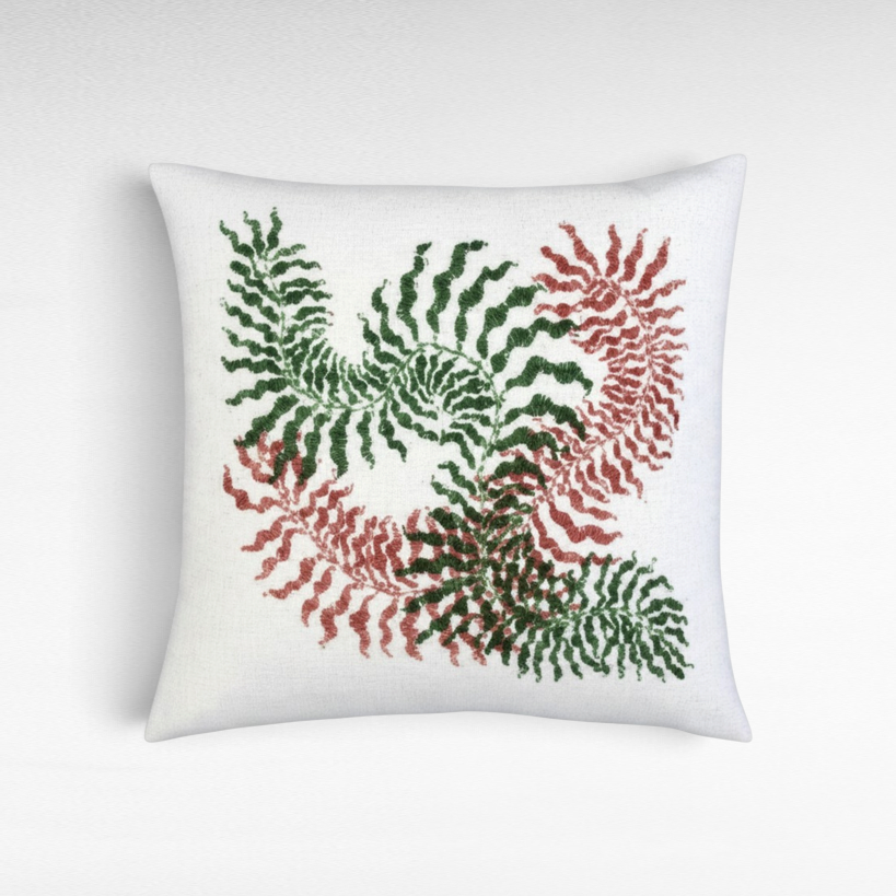 Chora Barefoot Luxury Living square white throw pillow featuring an embroidered red and green fern leaf pattern.