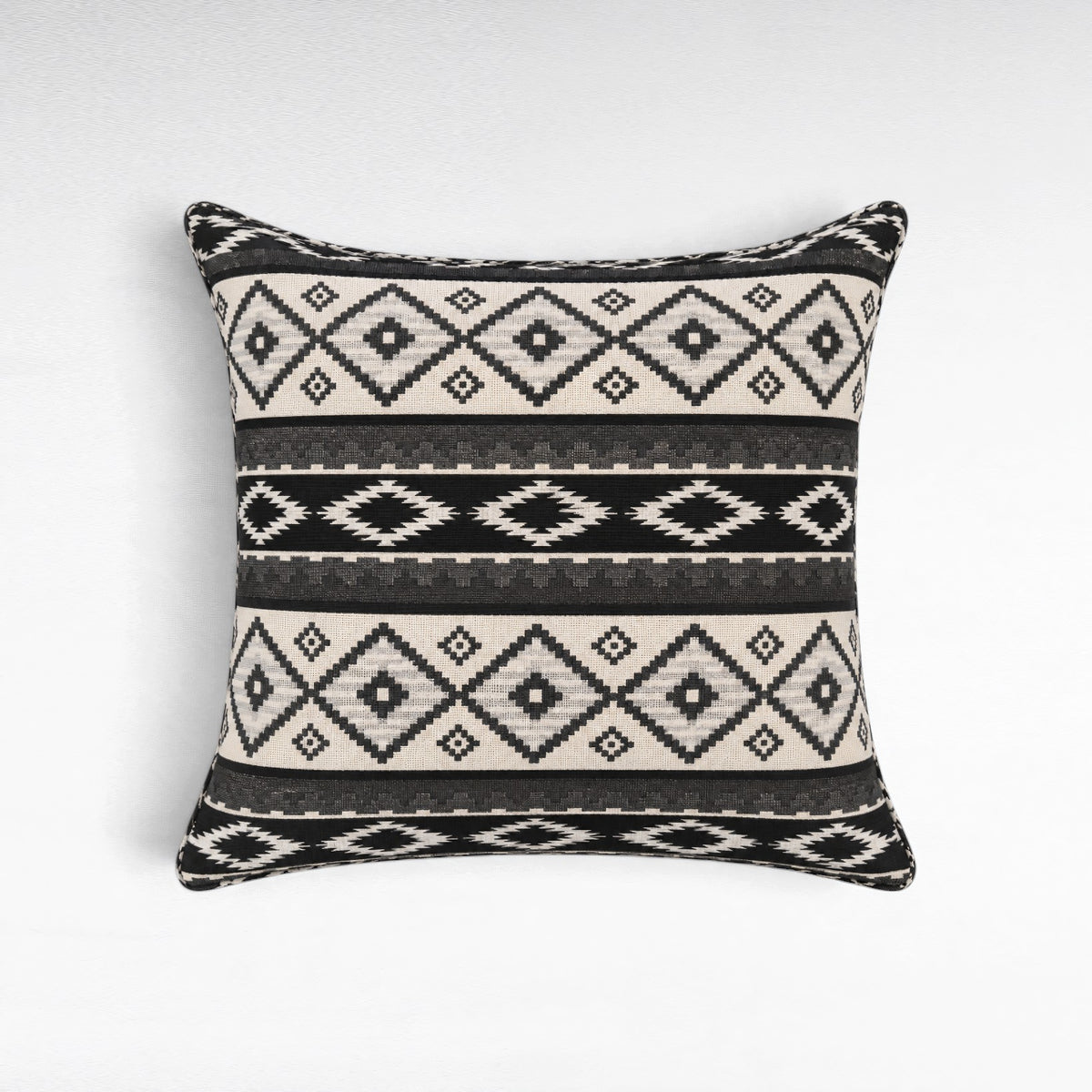 Chora Barefoot Luxury Living square cotton throw pillow featuring a black and white geometric tribal pattern