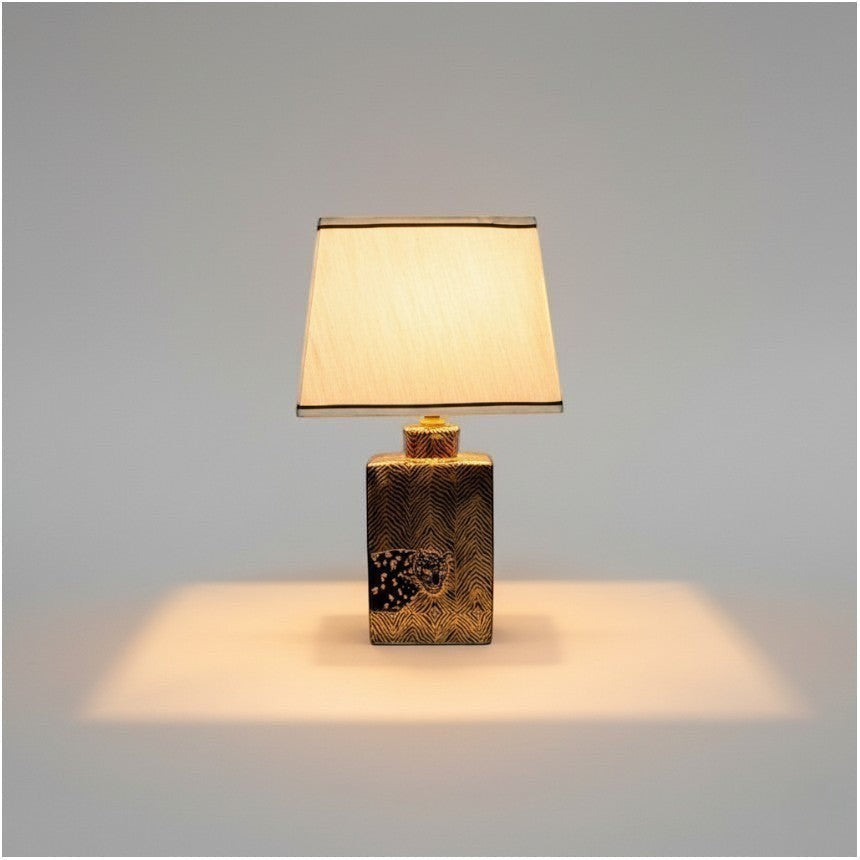 Chora Barefoot Luxury Living gold tiger table lamp with patterned base and cream shade.