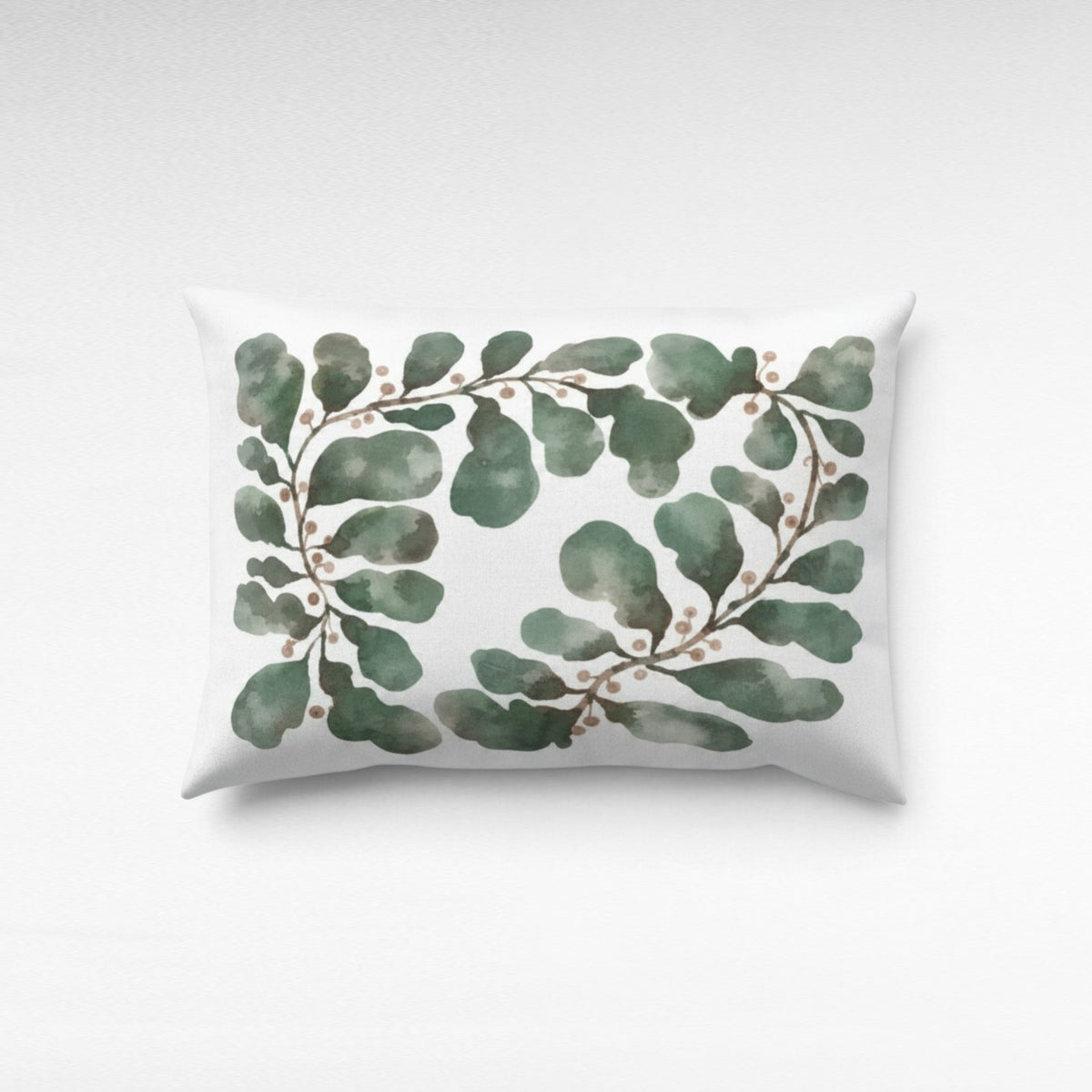 Chora Barefoot Luxury Living rectangular throw pillow featuring a watercolor green garland print on white fabric.