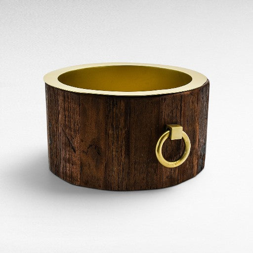 Chora Barefoot Luxury Living large round ice bucket made of natural dark wood with a shiny gold rim and a brass ring handle.