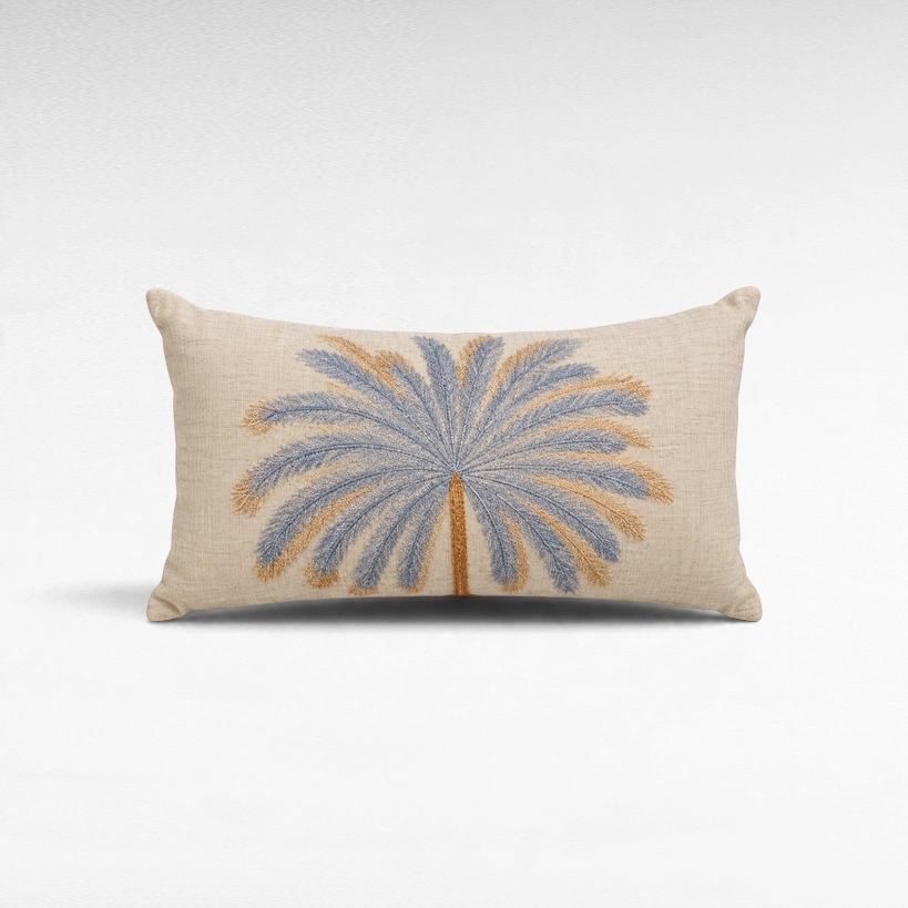 Chora Barefoot Luxury Living rectangular linen pillow featuring an embroidered blue and tan palm tree design.