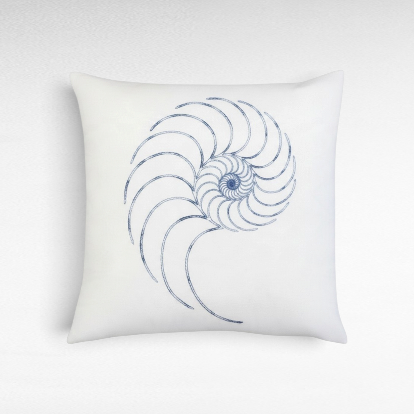 Chora Barefoot Luxury Living white square throw pillow featuring a detailed blue embroidered nautilus shell design.