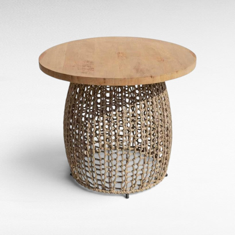 Chora Barefoot Luxury Living round dining table with a natural oak wood top and a hand-woven cotton rope base.