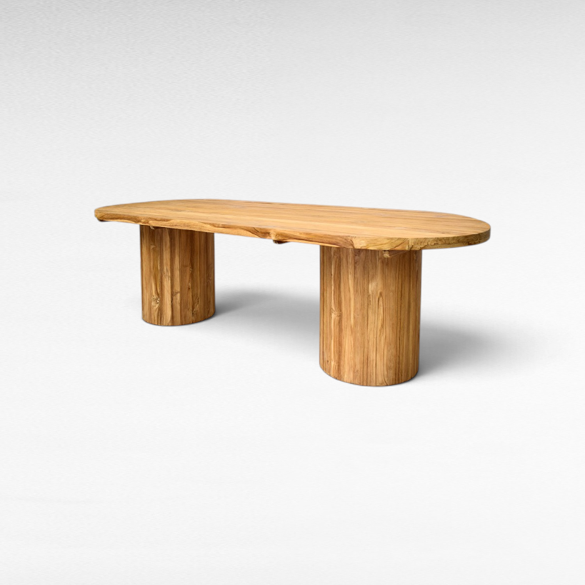 Chora Barefoot Luxury Living oval suar wood dining table with natural grain patterns and sculptural pedestal bases