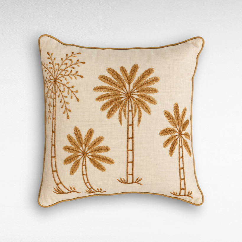 Chora Barefoot Luxury Living square linen throw pillow with embroidered brown palm tree motifs and piped edges