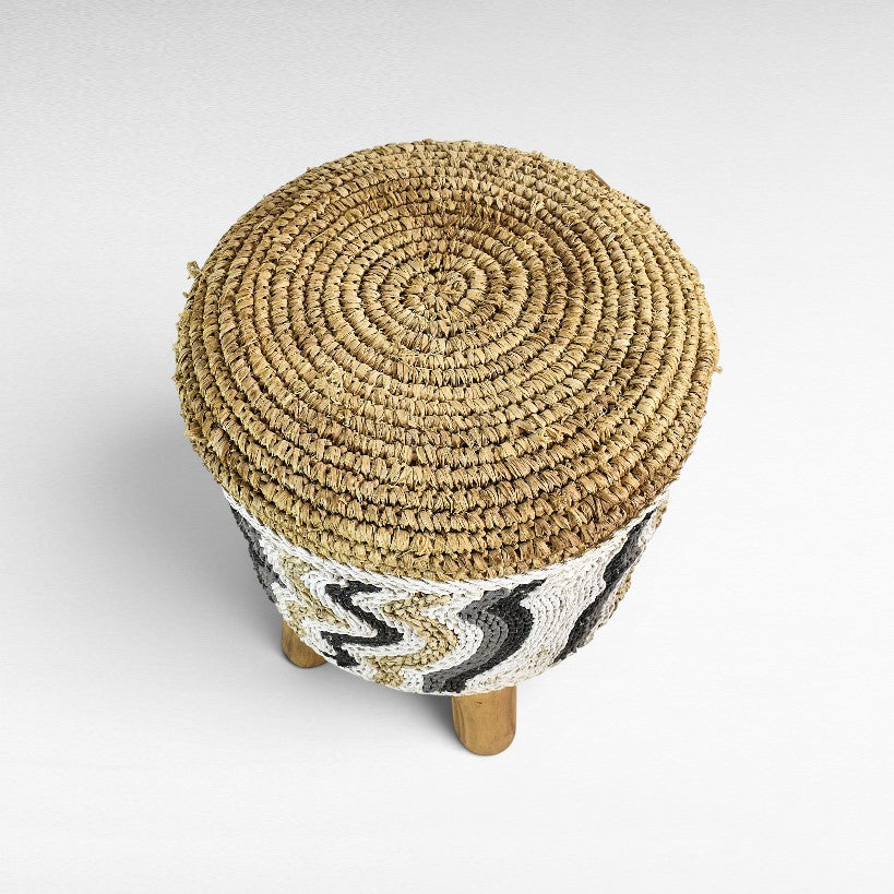 Chora Barefoot Luxury Living round stool with natural and white synthetic raffia woven top and patterned sides