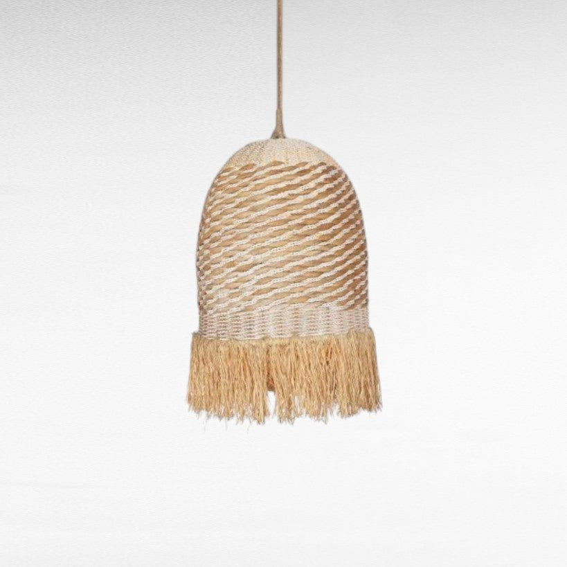 Chora Barefoot Luxury Living natural rattan and grass pendant light with white accents and fringe detail.