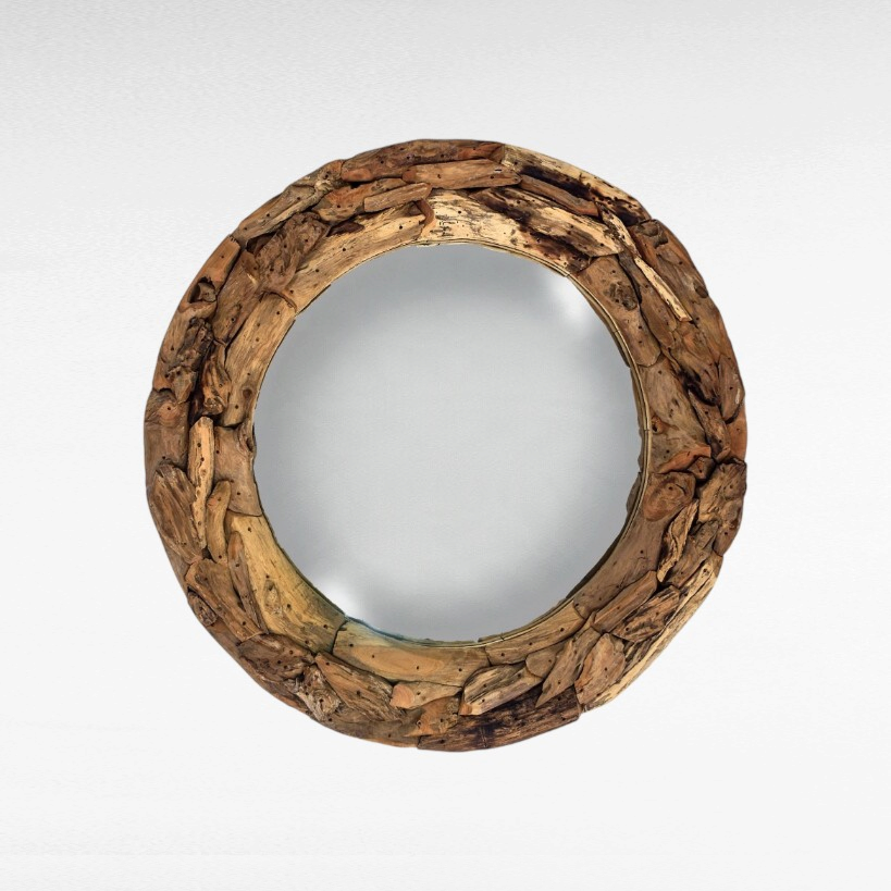 Chora Barefoot Luxury Living round mirror featuring a rustic frame made from textured recycled teak wood pieces.