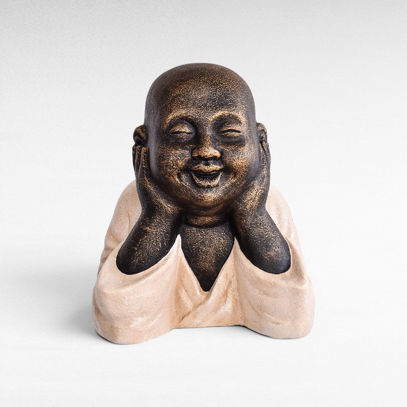Chora Barefoot Luxury Living Figurine Shaolin, a laughing Buddha statue made of fiber cement in bronze and cream colors.