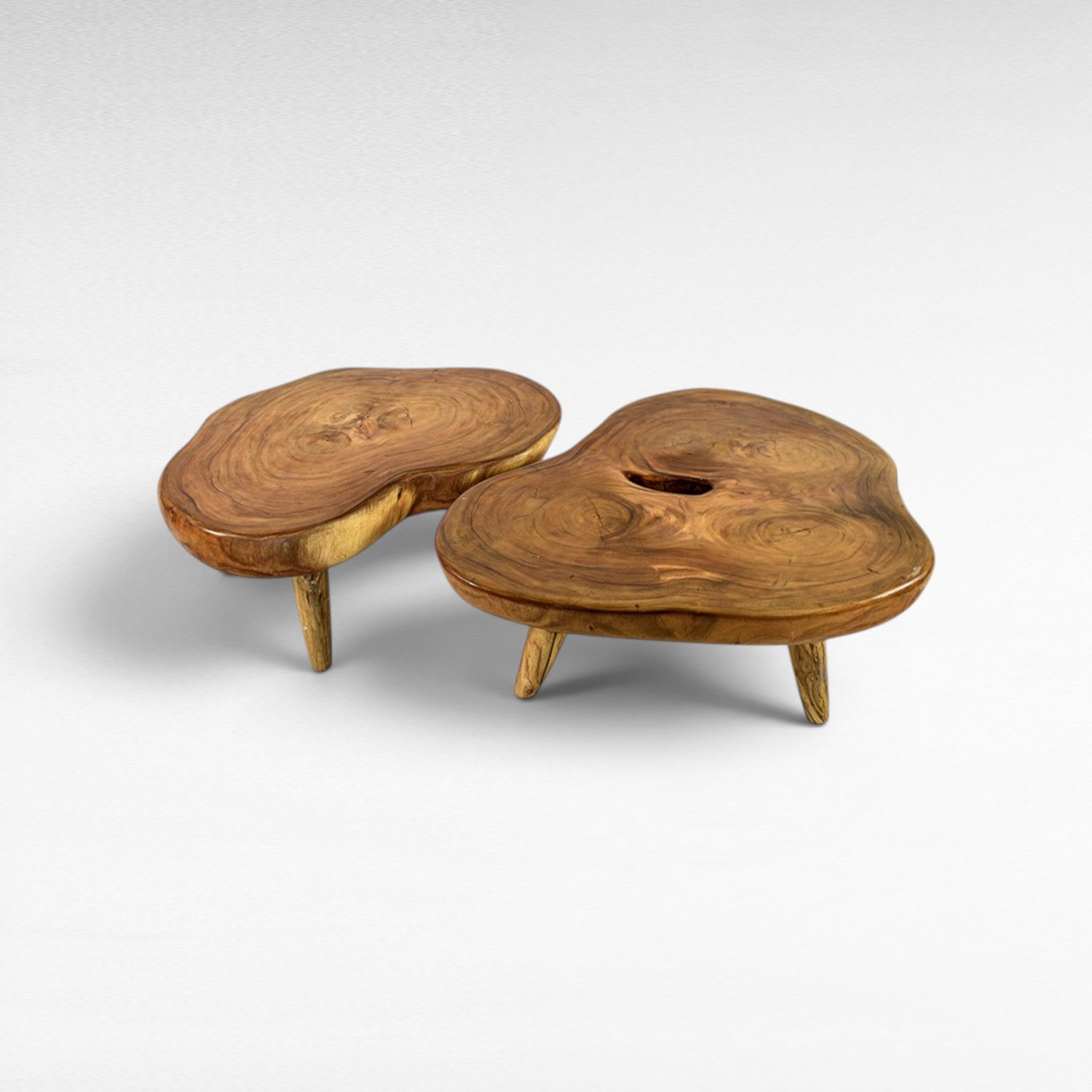 Chora Barefoot Luxury Living organic suar wood coffee table set with natural grain patterns and honey tones.