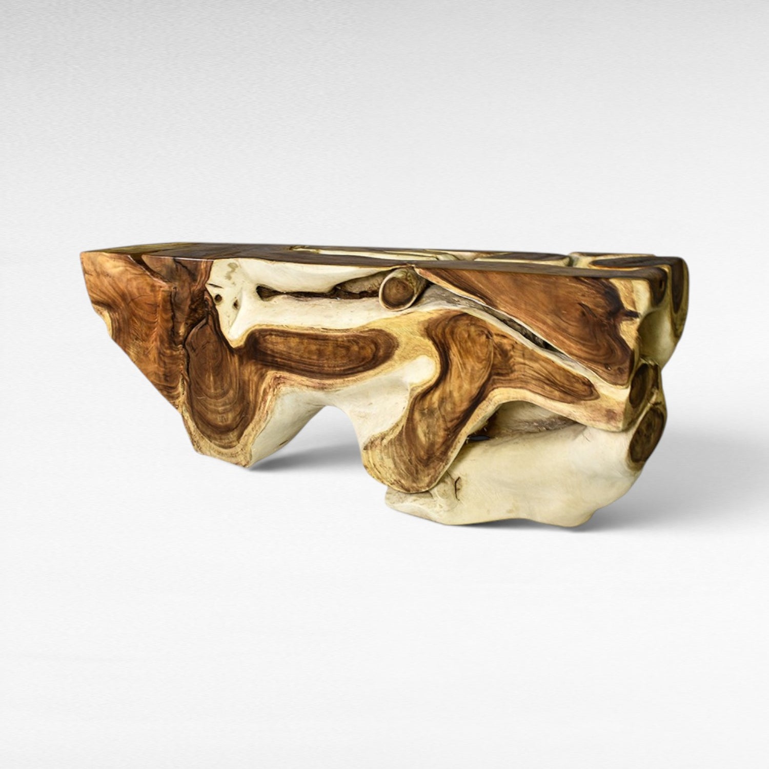 Chora Barefoot Luxury Living bleached and natural suar wood console table with organic, carved details.