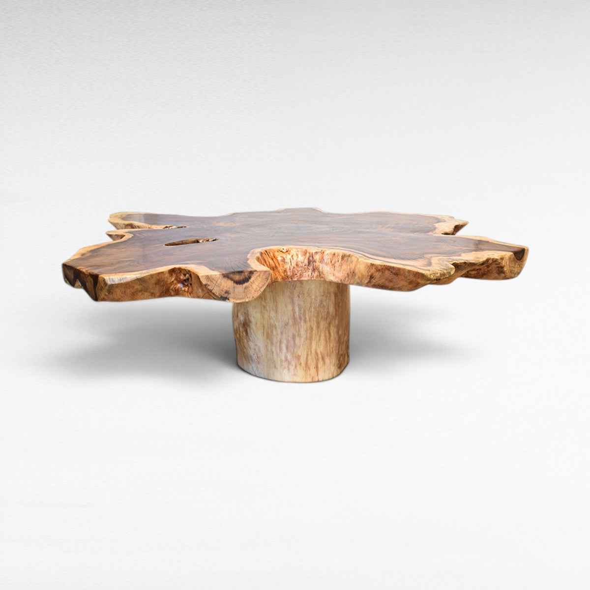 Chora Barefoot Luxury Living suar wood star shaped coffee table with natural live edge and unique wood grain.