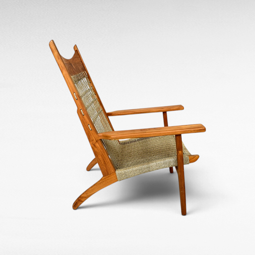 Chora Barefoot Luxury Living teak wood armchair with woven synthetic raffia seat and decorative knotted back profile