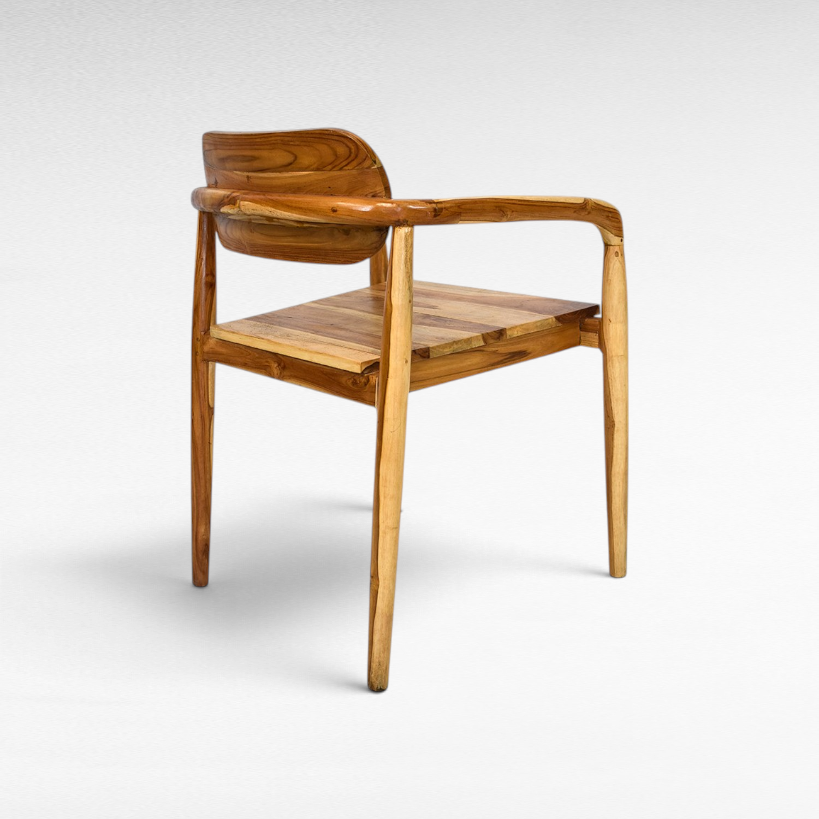 Chora Barefoot Luxury Living handcrafted teak wood chair with natural grain and warm honey tones in a back view.
