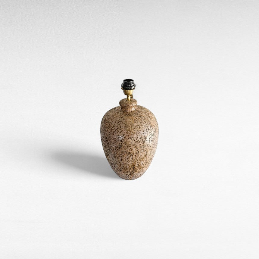 Chora Barefoot Luxury Living terracotta beige table lamp with textured base and black fixture.