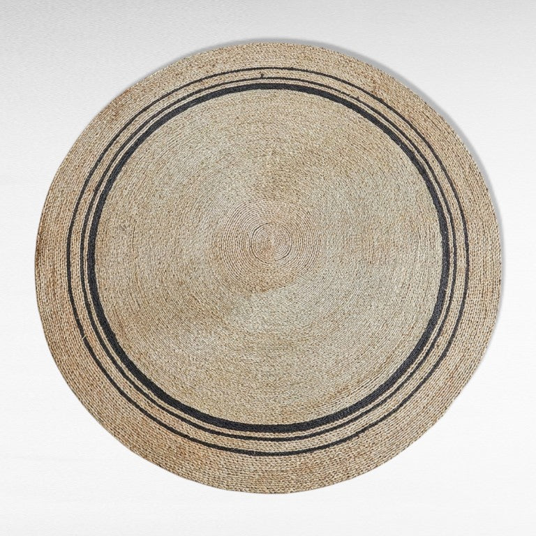 Chora Barefoot Luxury Living natural and black synthetic rattan round carpet, 200x200cm, with concentric circle design.