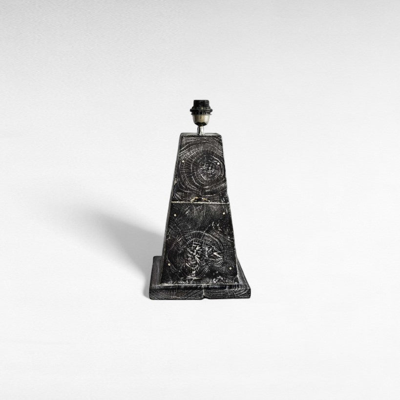 Chora Barefoot Luxury Living teak wood table lamp with a trapezoidal base and distressed black finish, showcasing wood grain patterns.