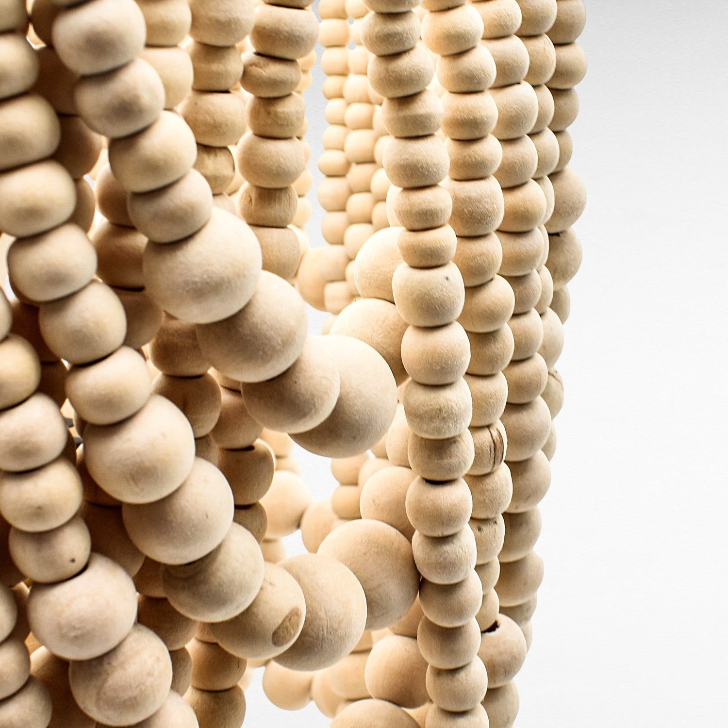 Chora Barefoot Luxury Living natural wood bead table lamp with a bleached finish.