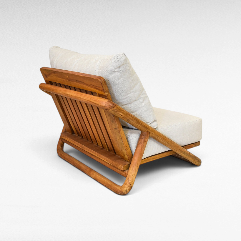 Chora Barefoot Luxury Living teak wood sofa chair with slatted backrest and off-white linen cushions