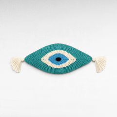 Chora Barefoot Luxury Living handmade knitted eye pillow in teal, blue, and white with decorative side fringes.