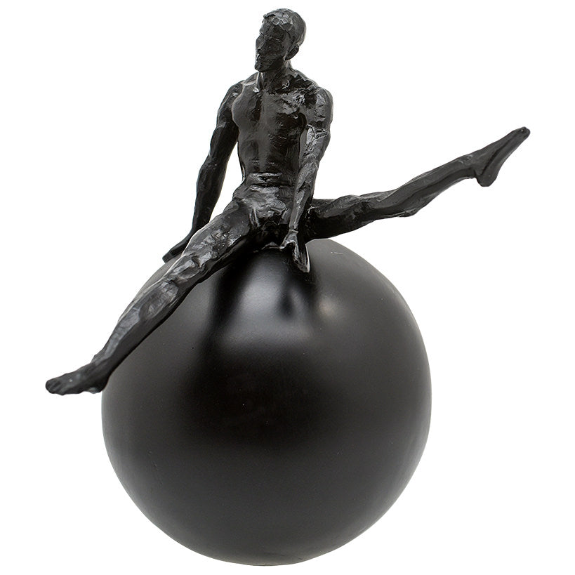 BLACK FIGURINE ON BLACK SPHERE