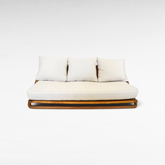Chora Barefoot Luxury Living teak wood sofa set with a warm honey finish and plush cream-colored cushions.