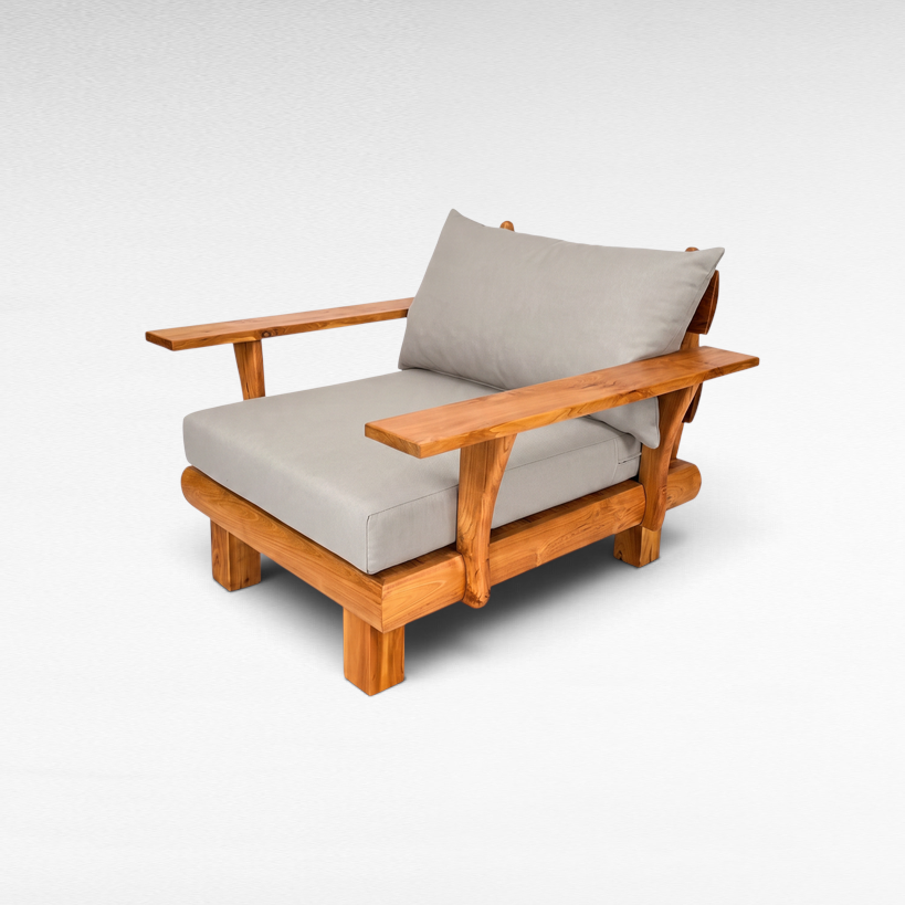 Chora Barefoot Luxury Living teak wood armchair with comfortable grey cushions and wide wooden armrests