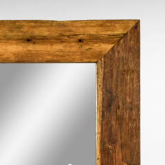 Chora Barefoot Luxury Living rectangular wall mirror with a rustic natural teak wood frame on a white wall